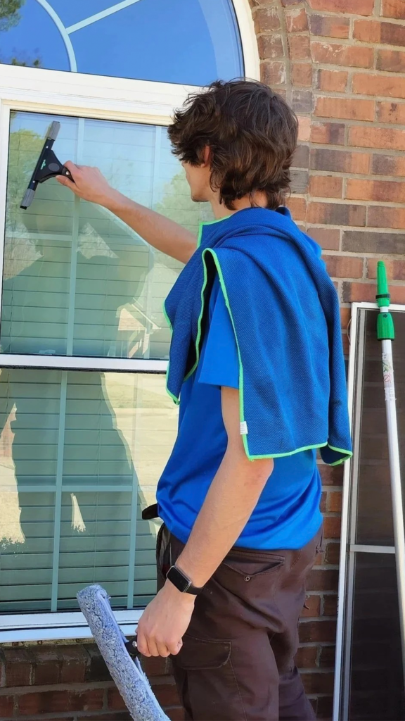 Professional window cleaner from Clear Clean Window Service cleaning exterior windows
